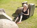 Christy sits amongst the stones (closer)